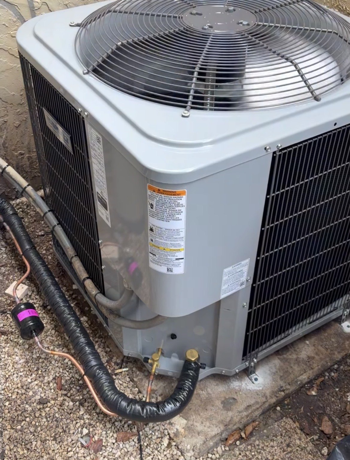 Close-up of outdoor condenser service connections