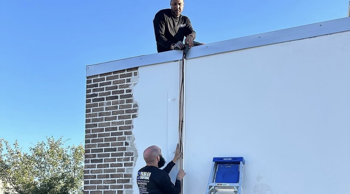 Line set installation from rooftop to exterior wall