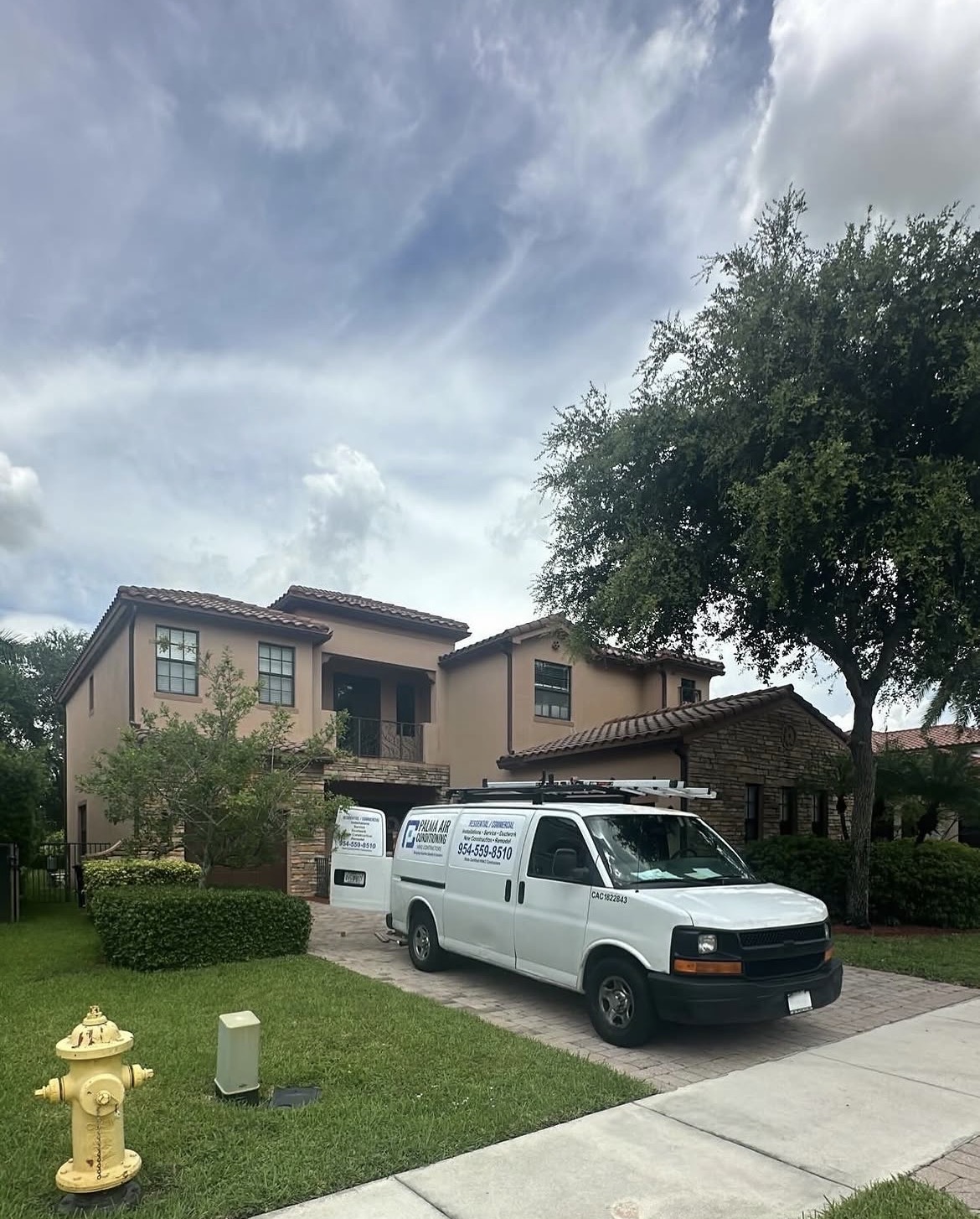 Palma Air Conditioning service van at residential home